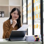 Asian Business woman using laptop
